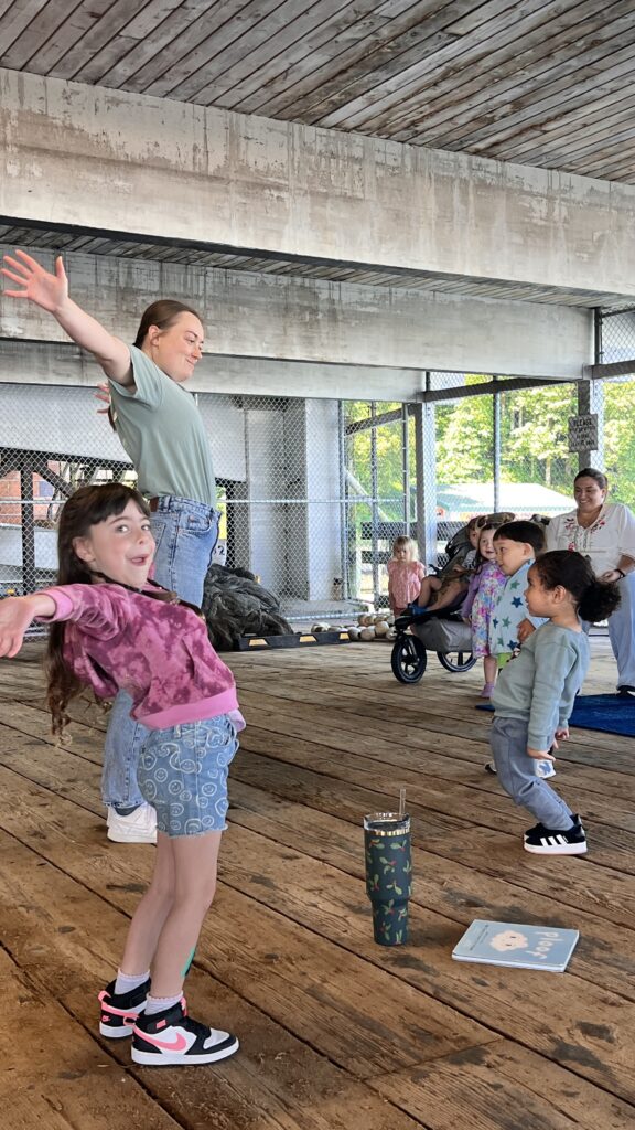Kids stretching along with an adult